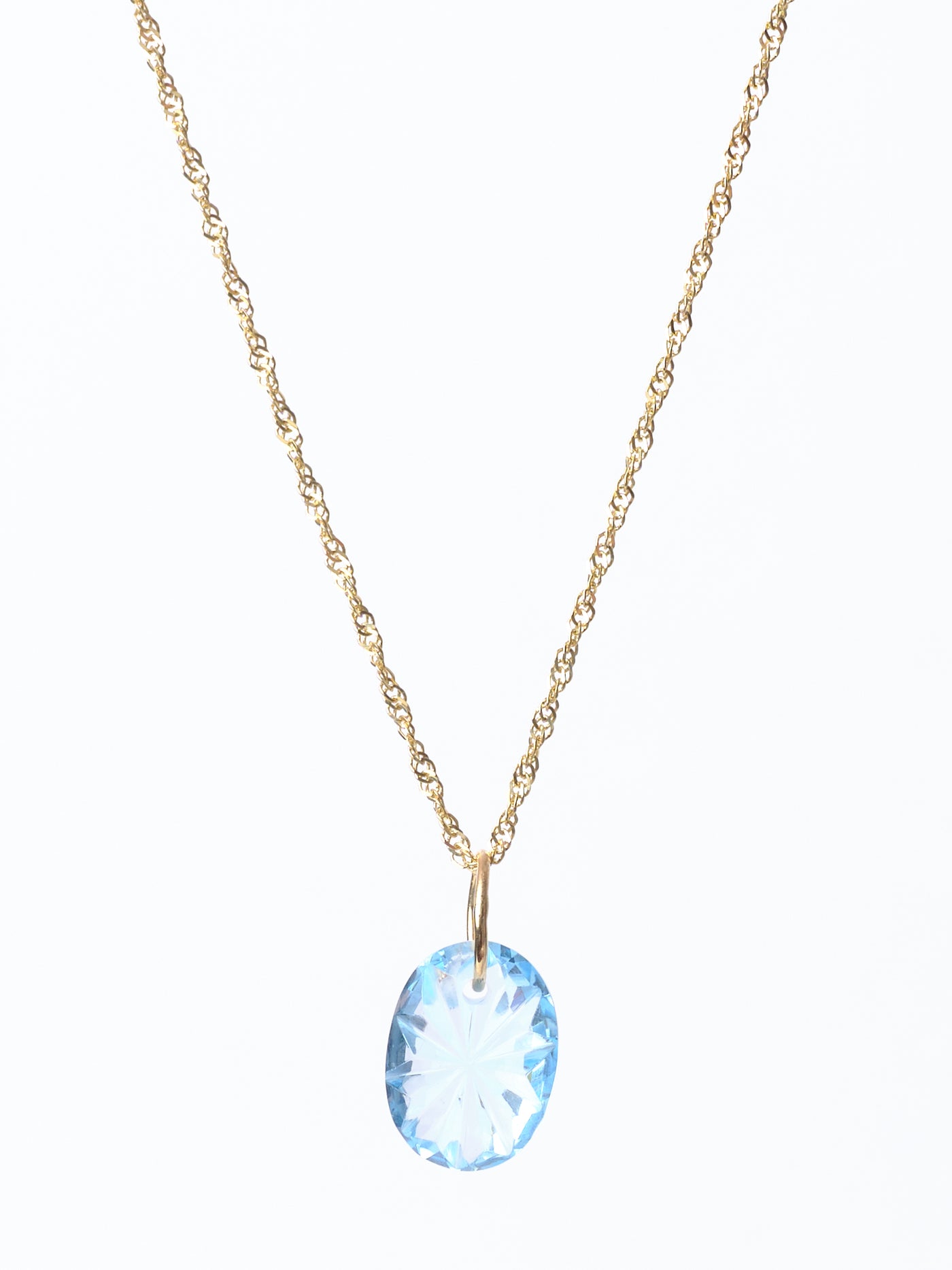 Carved Blue Topaz Pendant
